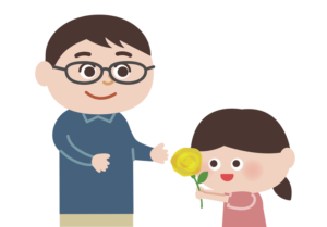 お父さんへ黄色いバラを渡す女の子
