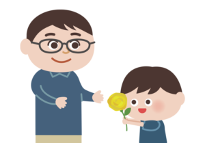 お父さんへ黄色いバラを渡す男の子