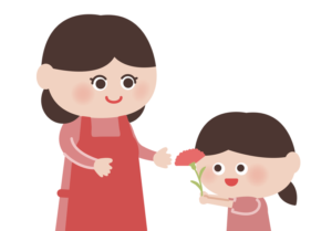 お母さんにカーネーションを渡す女の子