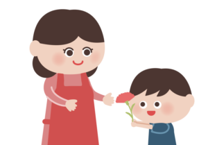お母さんにカーネーションを渡す男の子