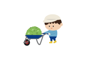 草を積んだ一輪車を押す男の子